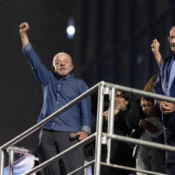 epa13332180 Brazilian President Luiz Inacio Lula da Silva (L), who won the runoff election with 51.79 percent of the vote, compared to 48.21 percent for far-right Senator Flavio Bolsonaro, reacts to supporters in Sao Paulo, Brazil, 25 October 2026.  EPA/ISAAC FONTANA