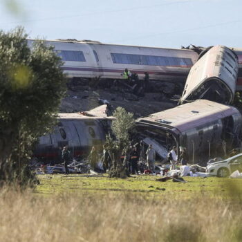 epa13336232 A general view showing the derailed carriages of the two high-speed trains (AVE in Spanish symbols), one of Renfe and another of Iryo, that have crashed in the village of Urda, Toledo, Spain, 28 October 2026. At least ten people have been killed, Spanish media reported.  EPA/ISMAEL HERRERO